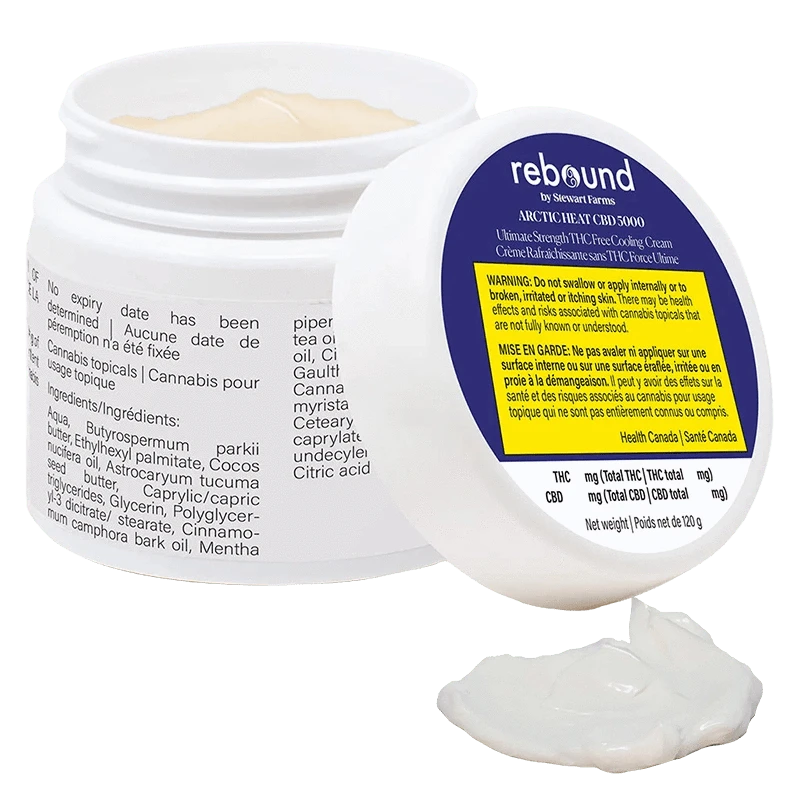 White jar of Arctic Heat Cbd 5000 Cooling Cream shown open at a three-quarter angle with the lid propped forward and a dollop of cream in front.