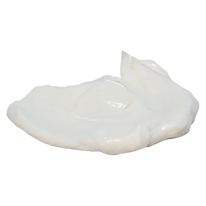 Close-up of a glossy white cream dollop on a plain background representing Arctic Heat Cbd 5000 Cooling Cream.