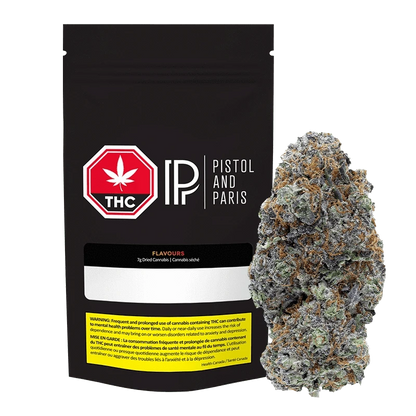 Front-facing black pouch and a dense frosted bud to its right, showing the 7 g Flavours Pistol and Paris packaging and cannabis.