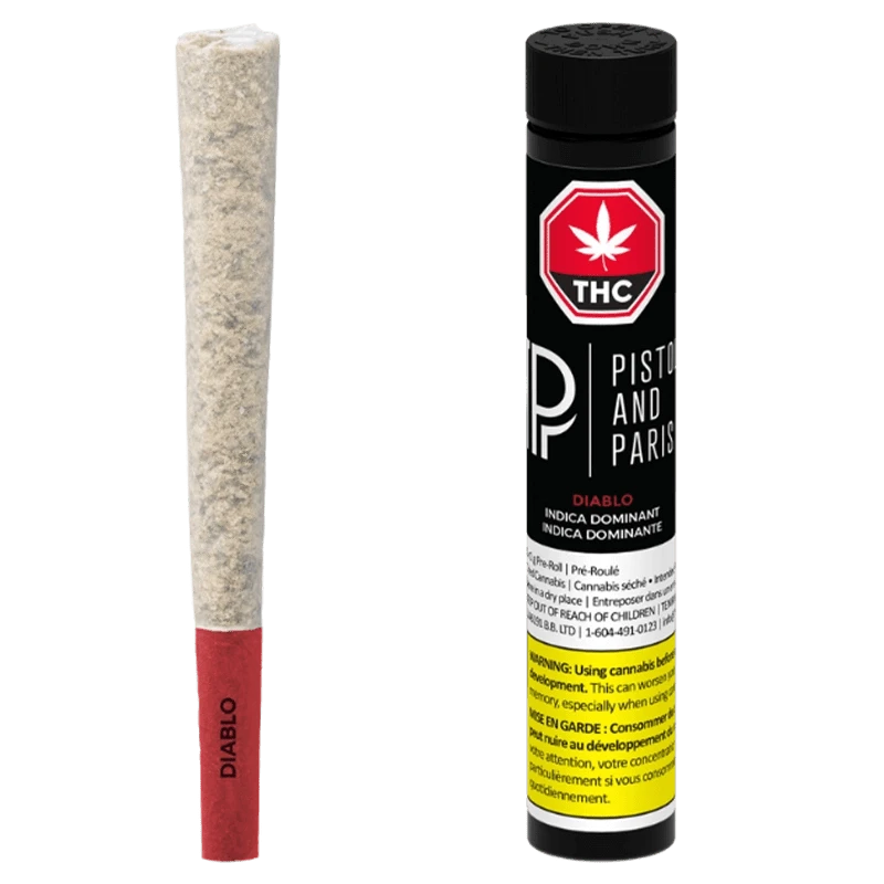 Studio-lit front view of a Diablo PR 1 x 1 g pre-roll with red paper tip beside its black Piston and Paris tube.
