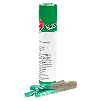 Tall front view of a green-and-white tube with two green Spinach pre-rolls laid in front, labeled "OG Kush PR 3 x 0.5 g."