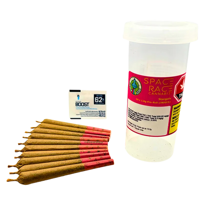 Cluster of pre-rolled joints fanned on a white surface beside a tall clear container labeled "Stargals PR 10 x 1 g" with a pink Space Race Cannabis sticker.