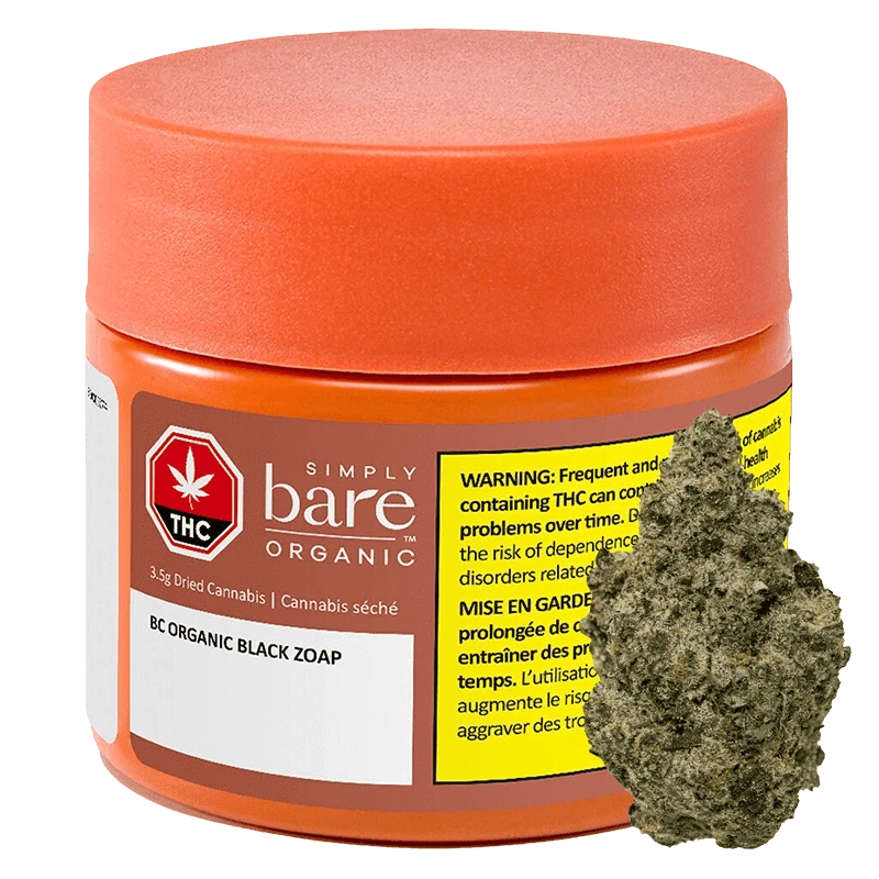 Three-quarter view of an orange jar labeled BC Organic Black Zoap with a yellow warning panel and a cannabis bud shown beside it.