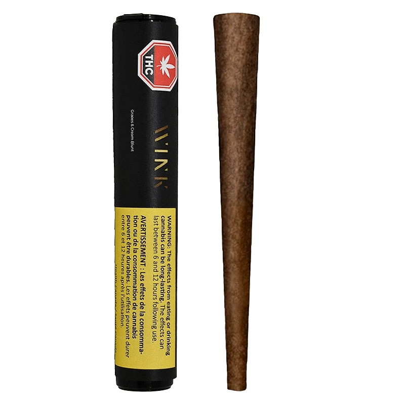 Front-facing shot of a Grapes and Cream Blunt PR 1 x 2 g tube standing next to its brown rolled blunt on a plain background