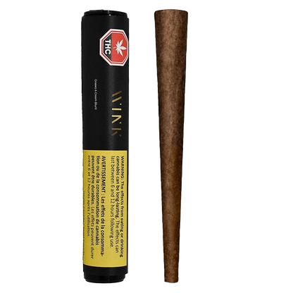 Front-facing shot of a Grapes and Cream Blunt PR 1 x 2 g tube standing next to its brown rolled blunt on a plain background