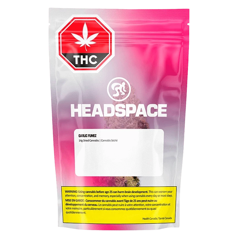 Front-facing shot of the pink-gradient Headspace Garlic Fumez pouch showing a THC warning symbol, white logo, and visible cannabis inside.