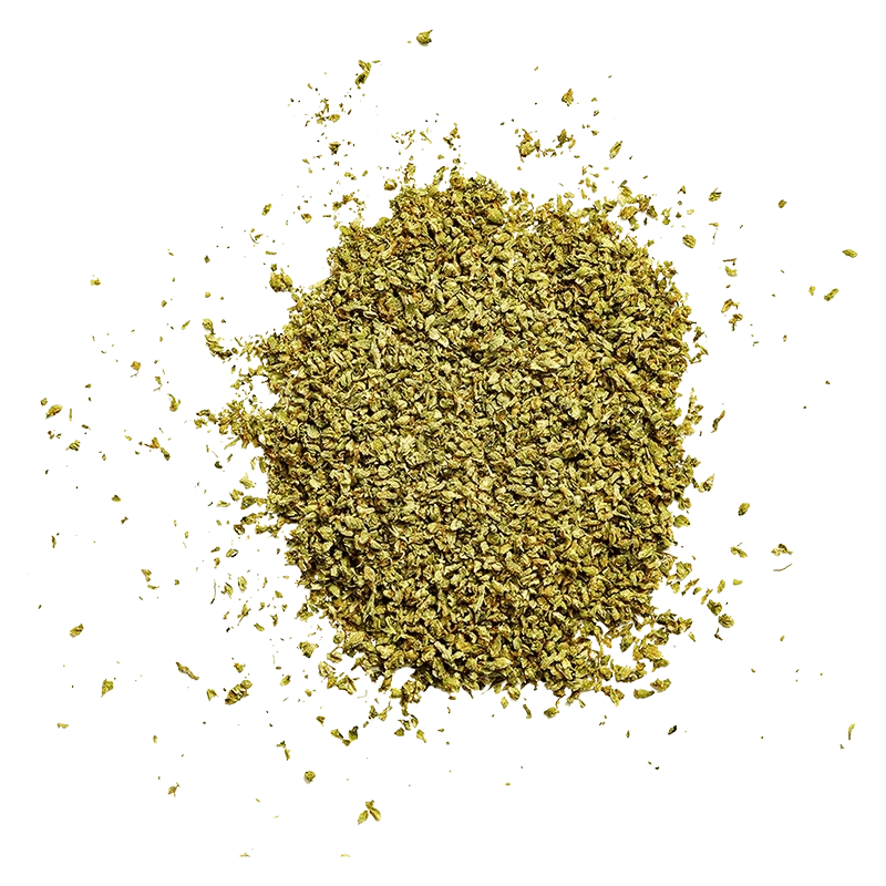 Top-down view of a loose, golden-brown pile of Cinna Crumbz with scattered crumbs on a pale background