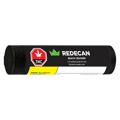 Horizontal studio shot of a black tube labeled "RedeCan Beach Crasher PR 3 x 0.5 g" with a red THC symbol and yellow warning panel.
