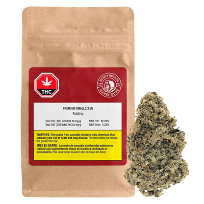 Front view of a kraft pouch and nearby bud showing the Premium Smalls 3.5 g label and a red THC badge on the package.