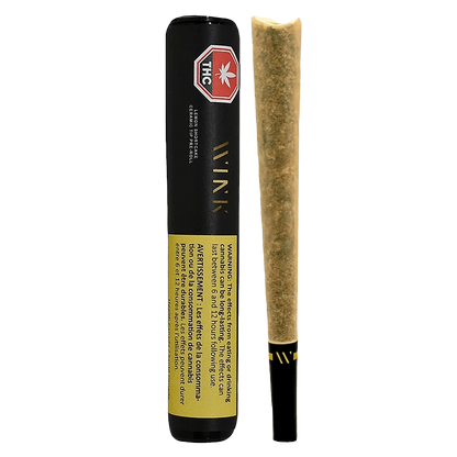 Vertical front view of a Lemon Shortcake Ceramic Tip PR 1 x 2 g pre-roll in black tube packaging beside the unlit joint.