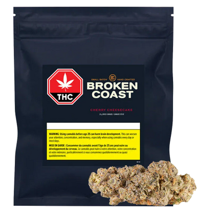 Front-facing black pouch labeled "Broken Coast Cherry Cheesecake" with a red THC stop sign logo and cannabis buds displayed at the base.