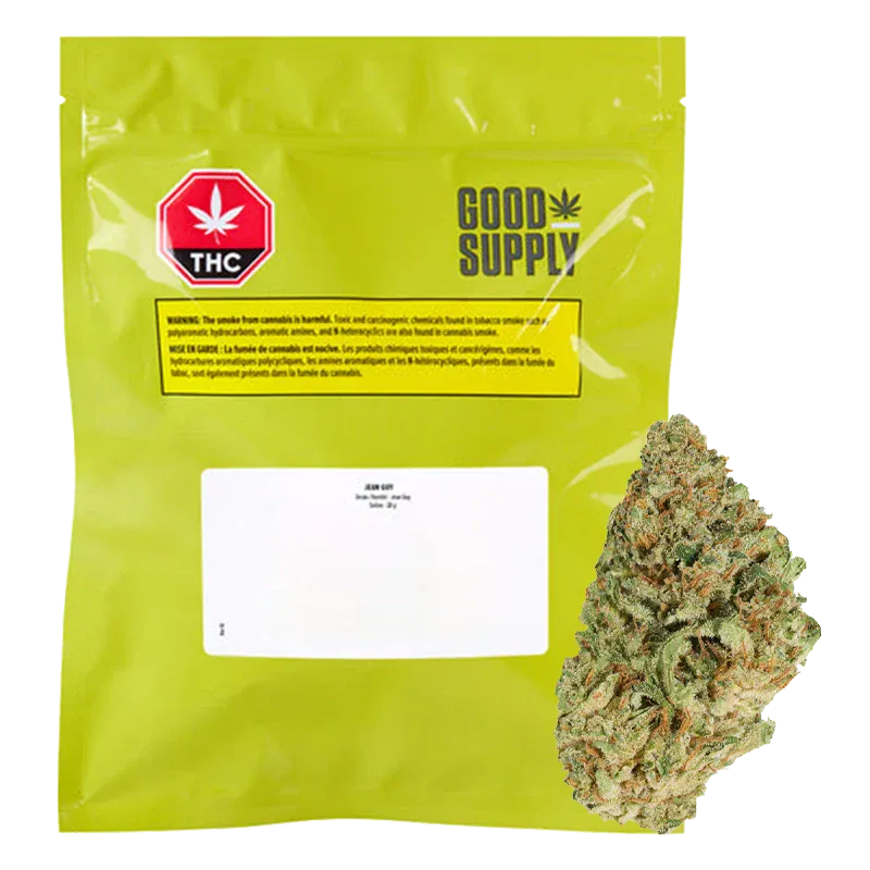Front-facing shot of the bright green Good Supply Jean Guy pouch with a white label and a single cannabis bud beside it.