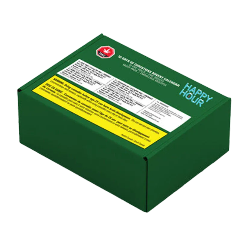 Angled view of a dark green box labeled "Twelve Days of Christmas Advent Box PR 12 x 0.5 g" with white and yellow warning panels and "HAPPY HOUR" text on the lid
