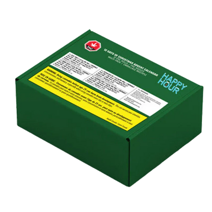 Angled view of a dark green box labeled "Twelve Days of Christmas Advent Box PR 12 x 0.5 g" with white and yellow warning panels and "HAPPY HOUR" text on the lid