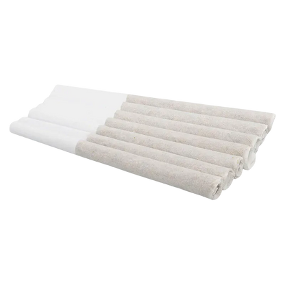 Angled close-up of eight rolled Winter Frost PR 7 x 0.5 g tubes laid side-by-side on a white background, showing textured paper and white filter ends