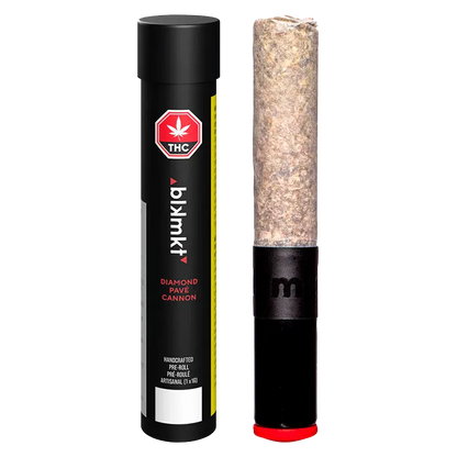 Close-up front view of the Diamond Pave Ceramic Tip Cannon PR 1 x 1 g standing upright next to its black cylindrical tube label.
