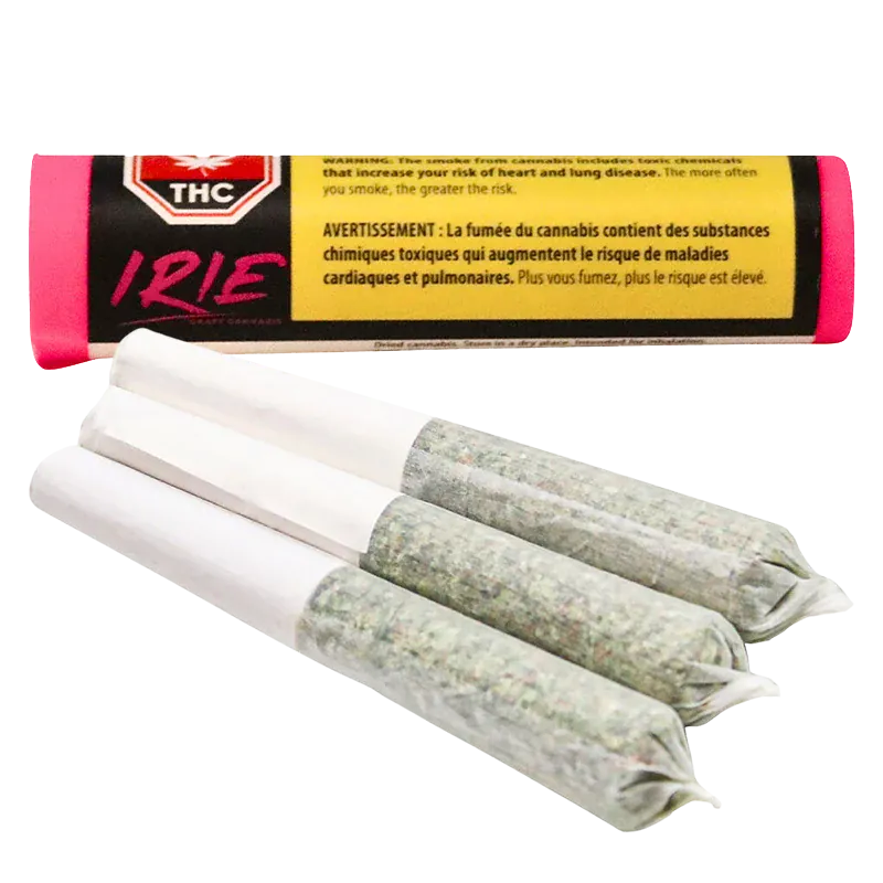 Close-up of three pre-rolled joints fanned in the foreground with an Irie PR 3 x 0.5 g tubular pink and black package blurred behind.