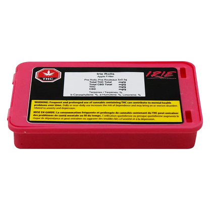 Low-angle front view of a bright pink rectangular tin labeled "Irie PR 5 x 0.5 g" with a black and white product sticker and yellow warning box on top.