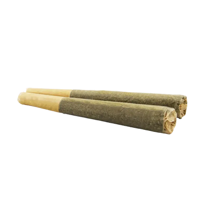 Low-angle close-up of two rolled organic pre-rolls labeled "Organic Electric Skunk PR 2 x 1 g" resting side by side on a white background