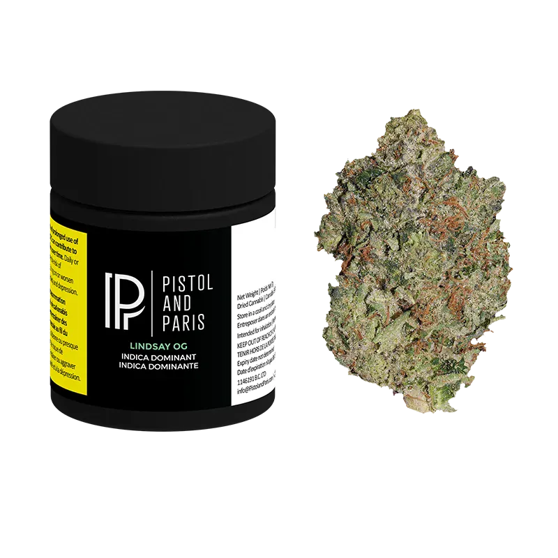 Three-quarter view of a black Pistol and Paris Lindsay OG jar with label details visible beside a frosty green bud on a white background