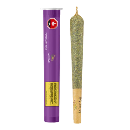 Straight-on product shot of the Peppermint Kush PR 1 x 2 g tube and joint standing side-by-side on a white background.