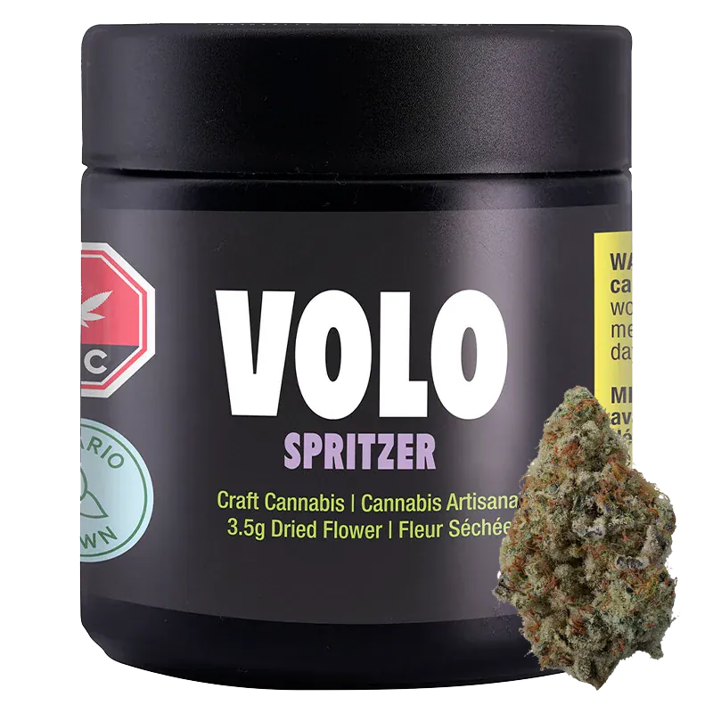 Front-facing shot of the VOLO Spritzer 3.5 g black jar with bold white logo and a cannabis bud leaning against its lower right.