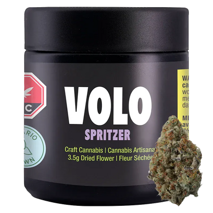 Front-facing shot of the VOLO Spritzer 3.5 g black jar with bold white logo and a cannabis bud leaning against its lower right.