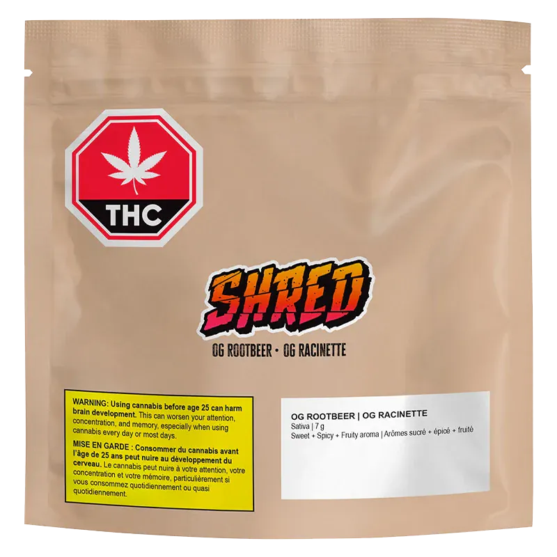 Front-facing shot of a tan pouch labeled "OG Rootbeer" with a colorful SHRED logo, THC warning icon, and ingredient panel.