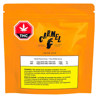 Front view of the bright orange Carmel Inside Joke pouch with a THC symbol at top left and a white warning label centered near the bottom