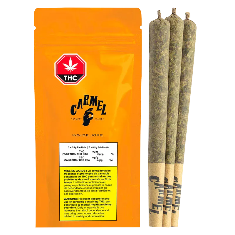Front-facing shot of the bright orange Carmel Inside Joke PR 3 x 0.5 g pouch standing next to three rolled pre-rolls on a white background.