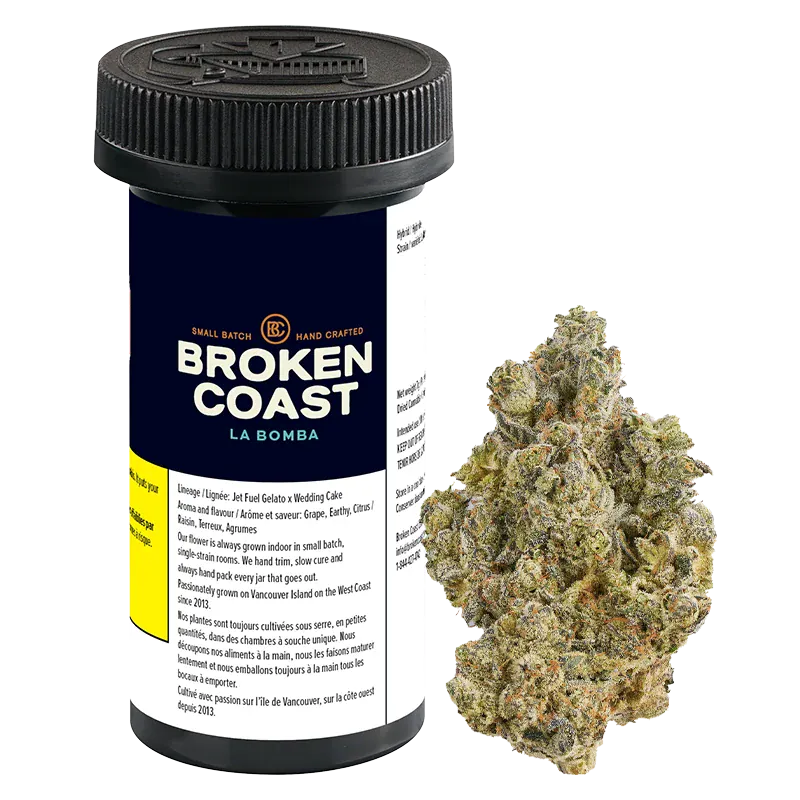Front-facing jar labeled "Broken Coast La Bomba" with a ridged black lid beside a close-up of a frosty green cannabis bud.