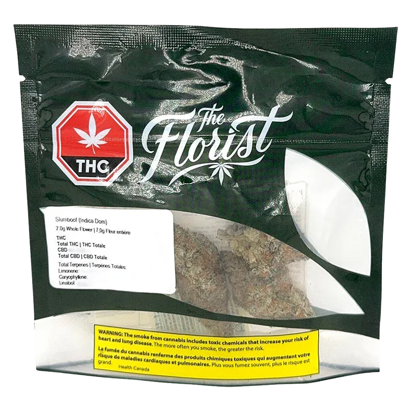 Front-facing shot of a black resealable pouch labeled Slurriboof showing a clear window with cannabis buds and bold "The Florist" logo.