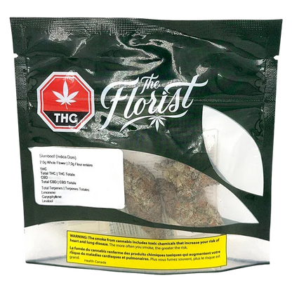Front-facing shot of a black resealable pouch labeled Slurriboof showing a clear window with cannabis buds and bold "The Florist" logo.