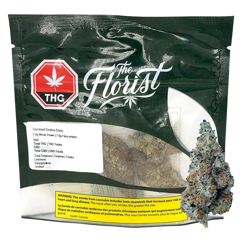 Front-facing pouch shot of The Florist Slurriboof showing a clear window with dense, frosty buds and a black branded top with a red THC emblem.