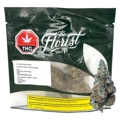 Front-facing pouch shot of The Florist Slurriboof showing a clear window with dense, frosty buds and a black branded top with a red THC emblem.