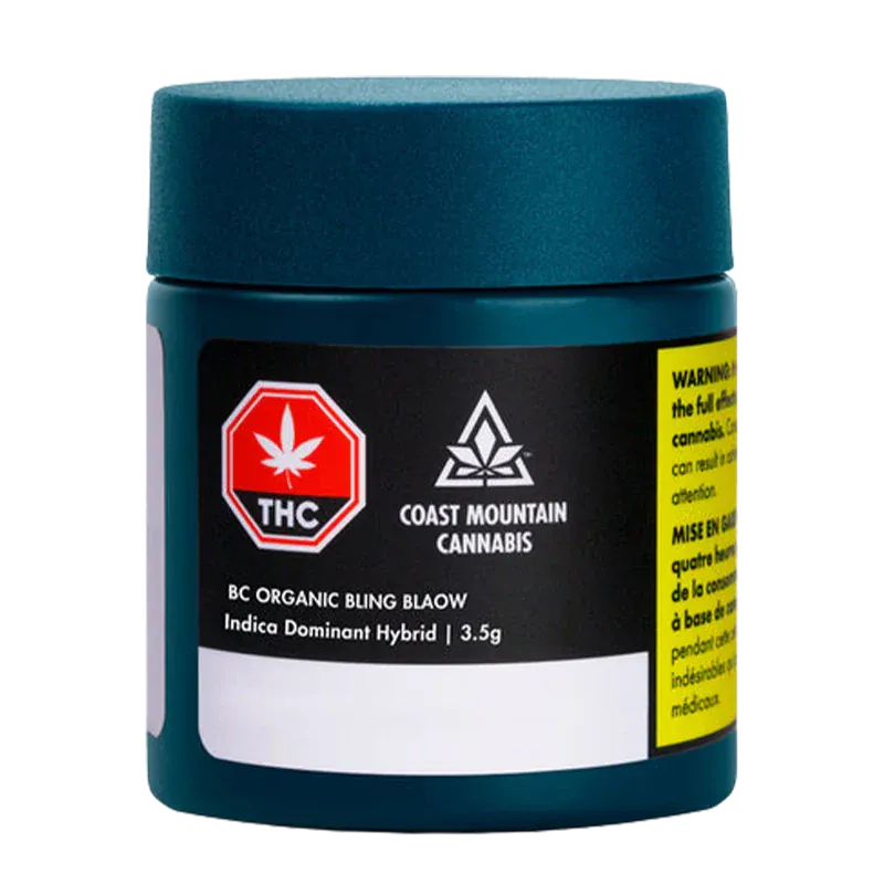 Front view of a teal jar labeled "BC Organic Bling Blaow" from Coast Mountain Cannabis with a black product label and warning tab.