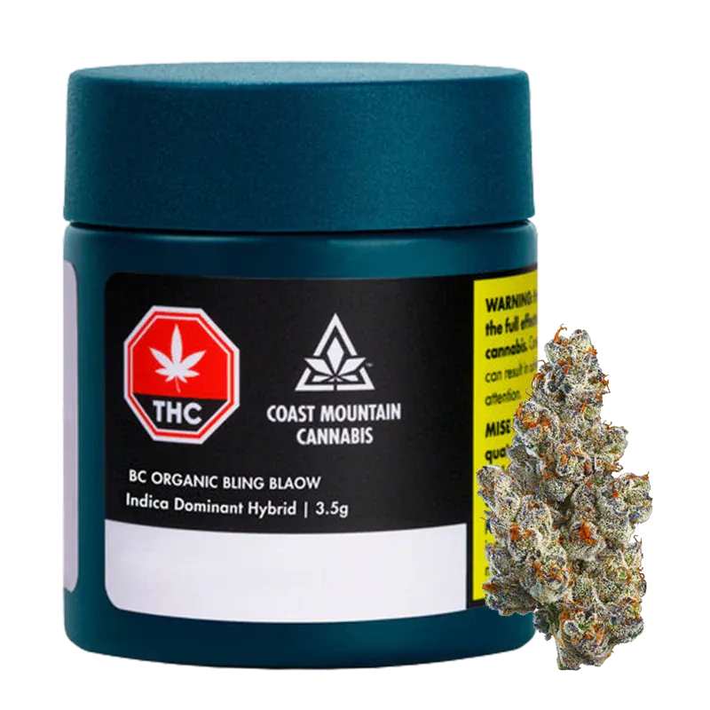 Front-facing shot of a teal jar and visible bud labeled "BC Organic Bling Blaow" from Coast Mountain Cannabis on a white background.