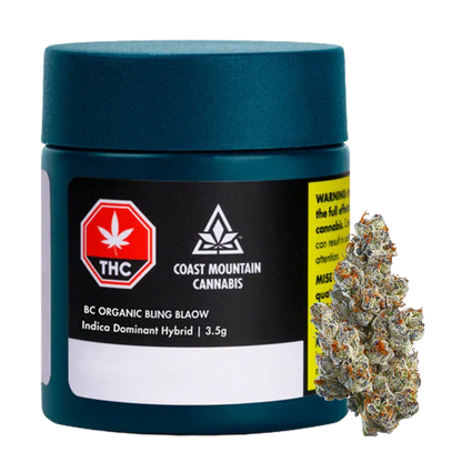 Front-facing shot of a teal jar and visible bud labeled "BC Organic Bling Blaow" from Coast Mountain Cannabis on a white background.