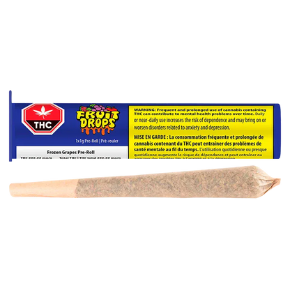 Horizontal view of a single rolled joint in front of the colorful Frozen Grapes PR 1 x 1 g packaging showing a blue label, THC symbol and yellow warning box.