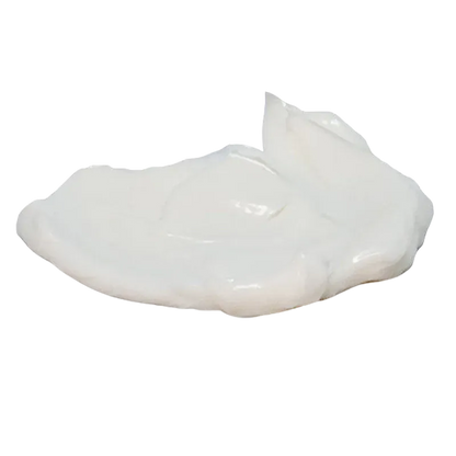 Close-up of a glossy white cream dollop of Arctic Heat Muscle Cream shown on a white background with soft side lighting.