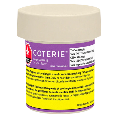 Front view of a small beige-lidded Coterie Grape Gotti #12 jar with a purple and yellow warning label visible around its body.