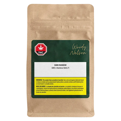 Front-facing kraft pouch with a dark green label reading Woody Nelson Dark Rainbow and strain details, shown on a white background.