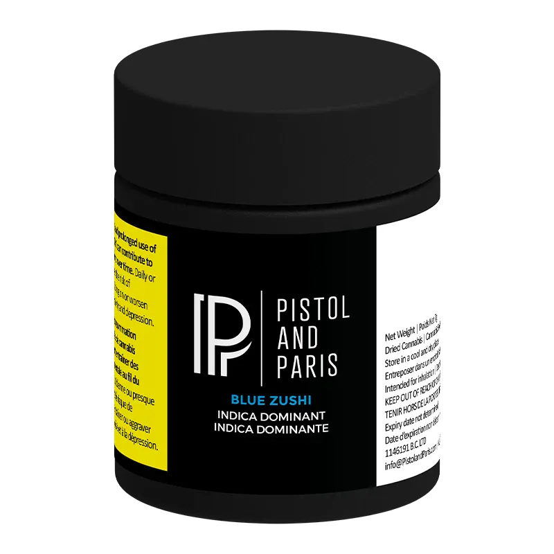 Three-quarter view of a black jar labeled "Pistol and Paris Blue Zushi" with a matte black lid and yellow and white side panels.