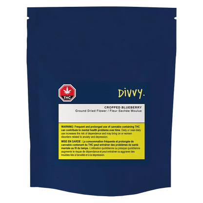Front-facing shot of the navy pouch labeled "Divvy. Cropped Blueberry" with a central white product label and yellow THC warning panel.