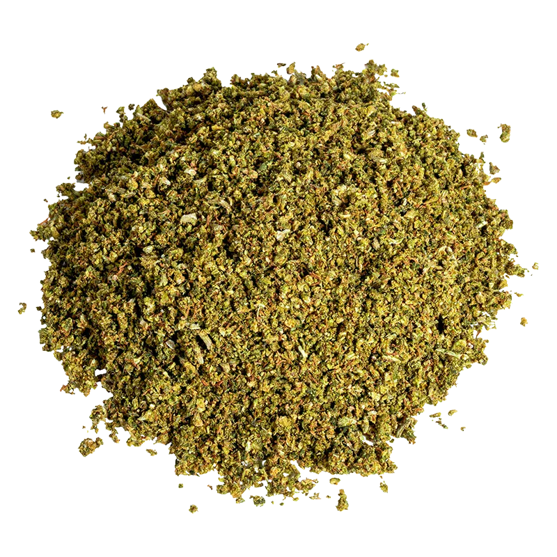 Top-down view of a loose pile of Cropped Blueberry showing fine greenish herb granules against a white background.