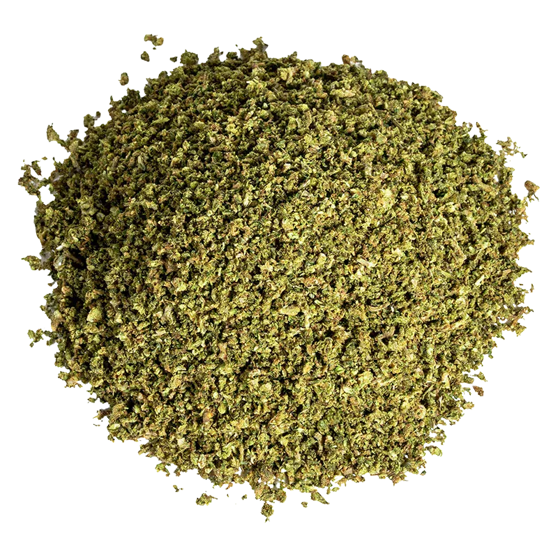 Top-down view of a loose pile of Cropped Sour Kush, finely ground and mottled green against a white background