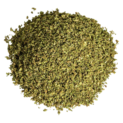 Top-down view of a loose pile of Cropped Sour Kush, finely ground and mottled green against a white background