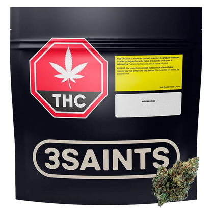 Front-facing shot of the 3SAINTS Marshmallow OG black resealable pouch with a red THC stop-sign label and a cannabis bud at the lower right.