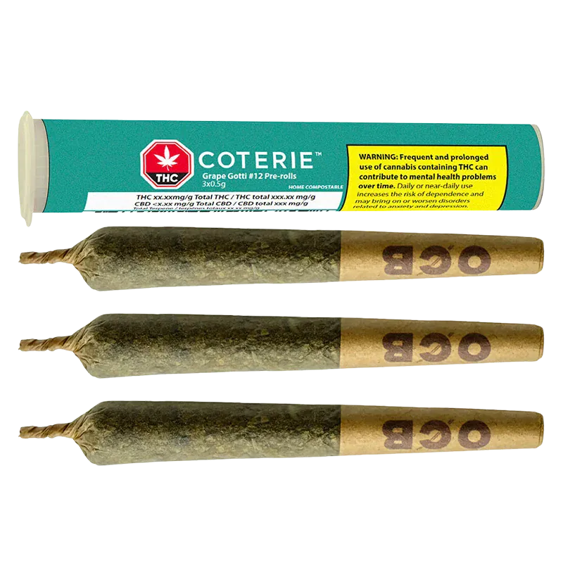 Horizontal flat-lay of three rolled joints with twisted tips and brown "OGB" filter ends below a teal Coterie Grape Gotti PR 3 x 0.5 g tube showing a yellow warning label.