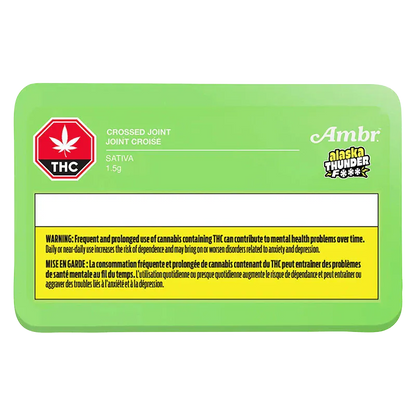 Top-down view of a bright green packet labeled "Alaskan Thunder Cross PR 1 x 1 g" with THC warning box and Ambr logo.